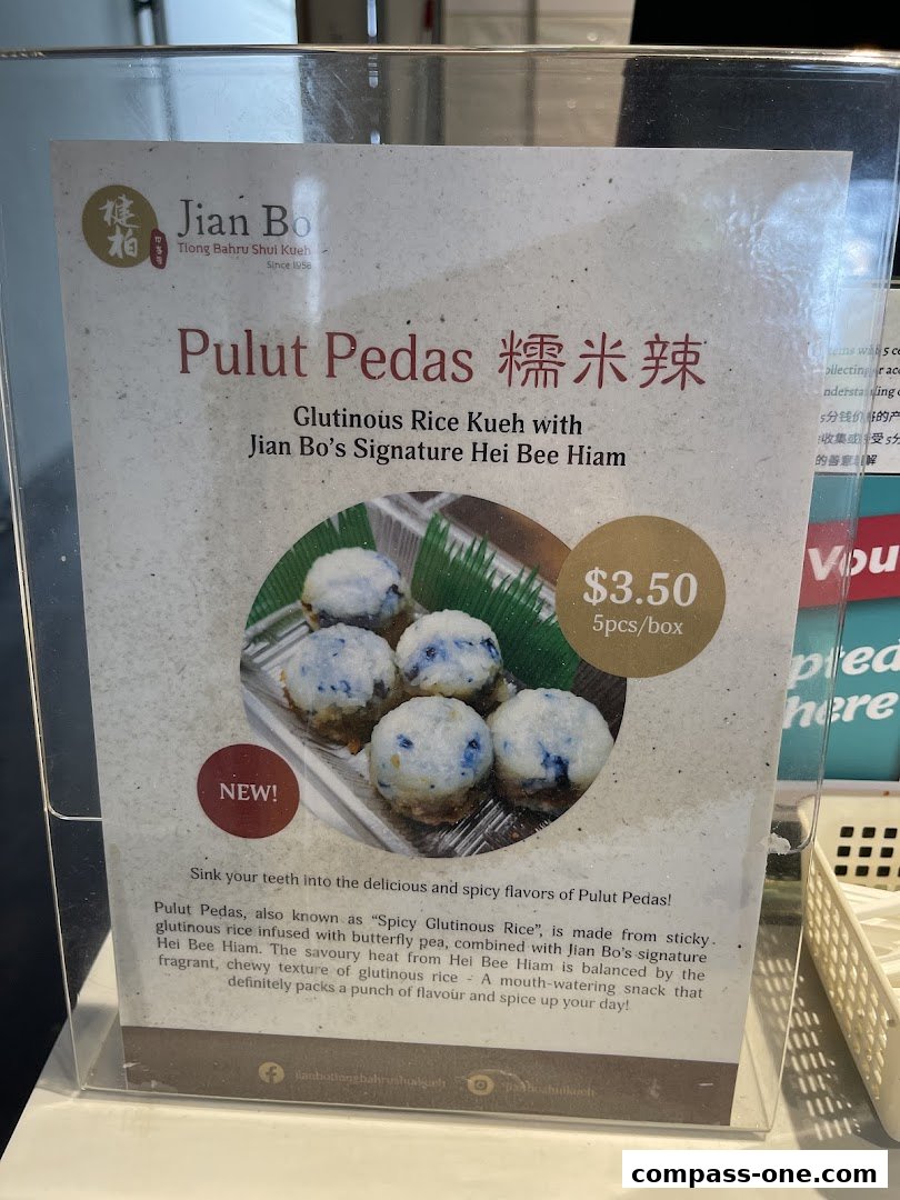 A sign advertising Jian Bo's Pulut Pedas, a spicy glutinous rice kueh.