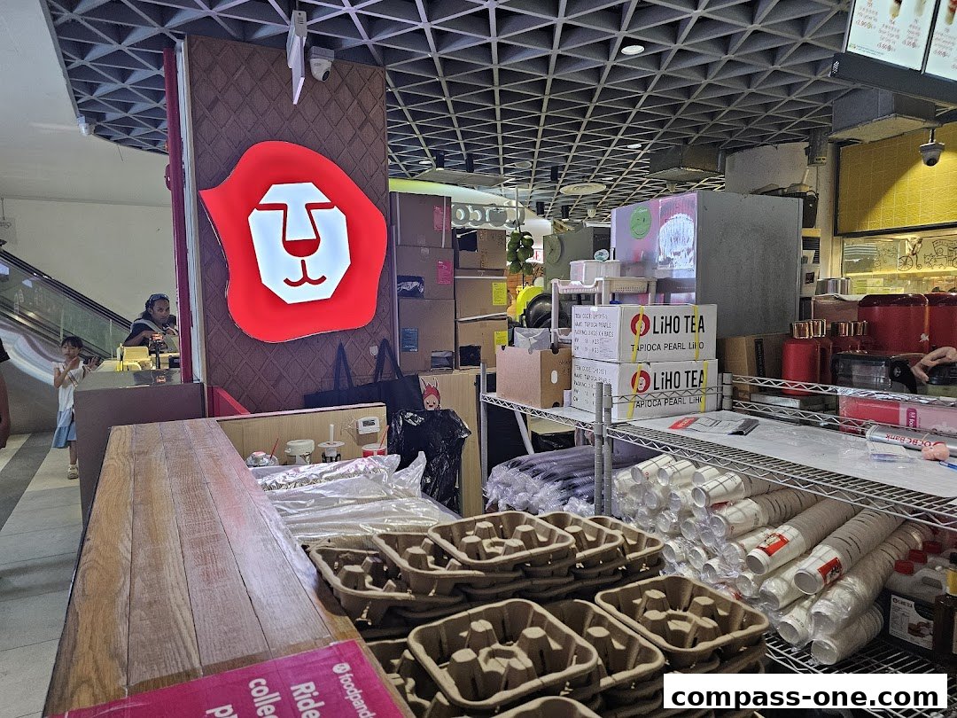 A LiHO TEA shop counter with supplies and branding visible.