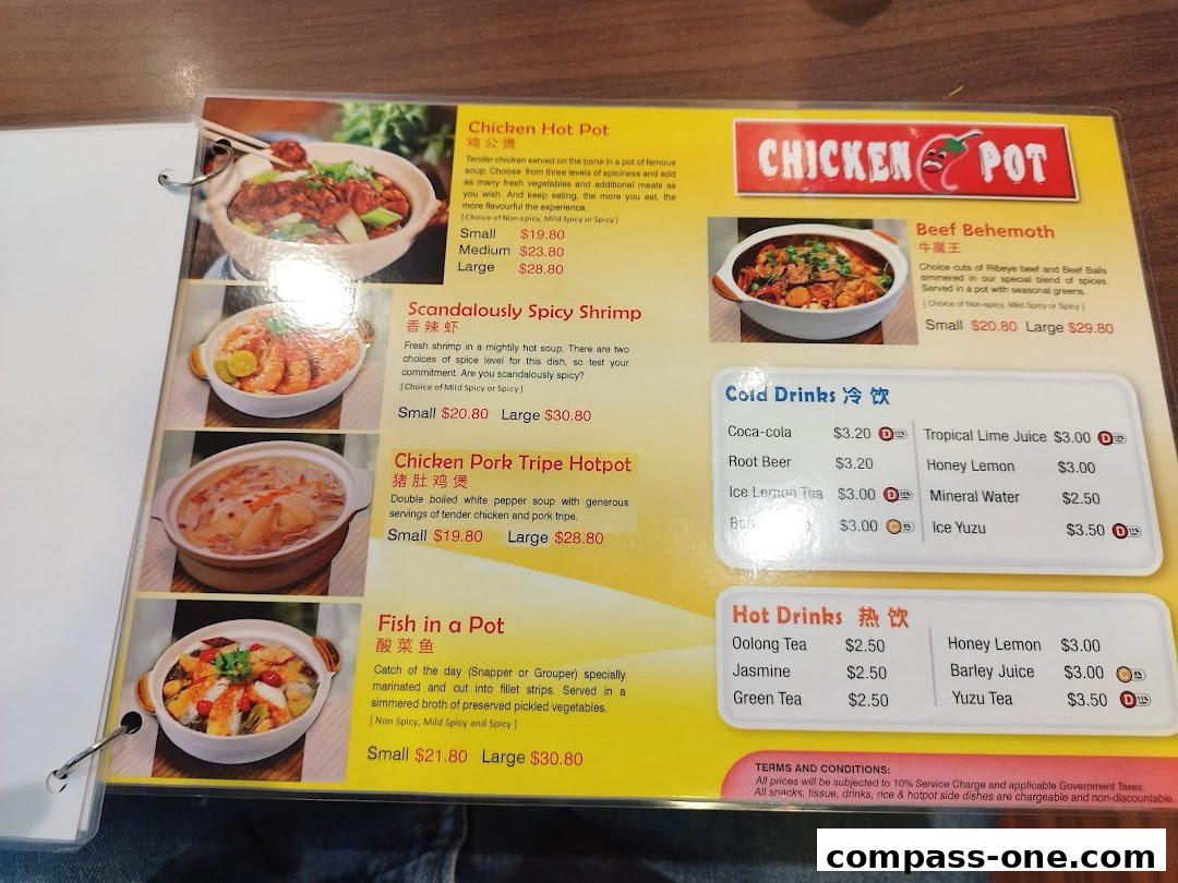 A menu from Chicken Hotpot Compass One featuring various hotpot dishes and drinks.