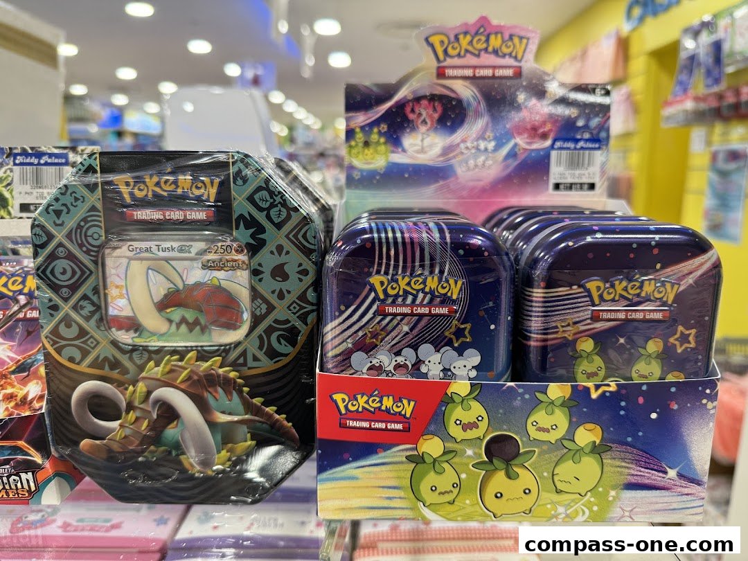 Pokemon trading card game tins and boxes displayed on shelves in a retail store.