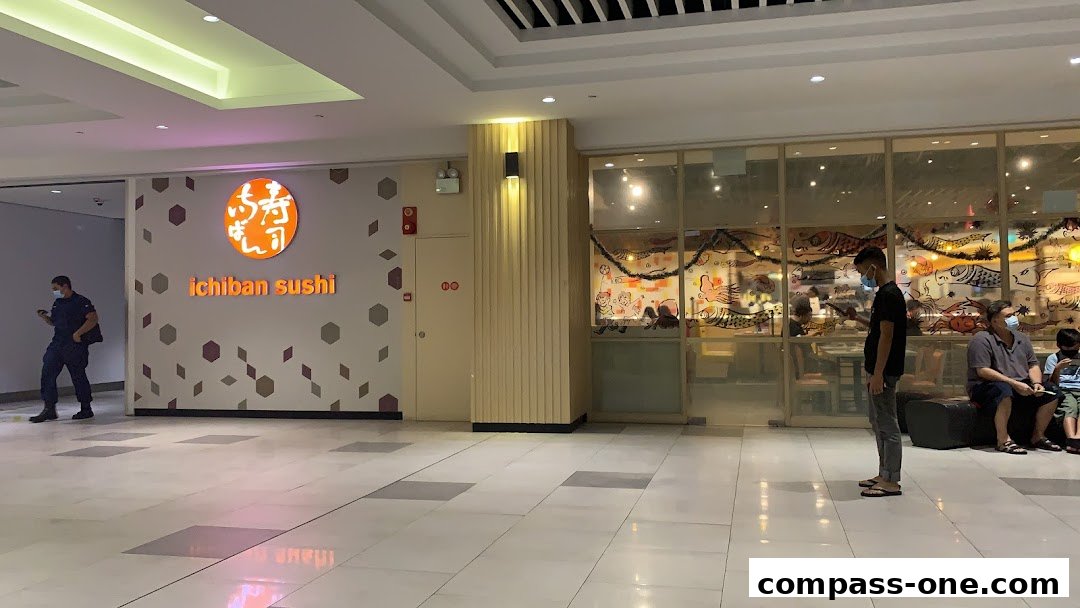 The exterior of Ichiban Sushi restaurant with its logo and interior visible through the windows.