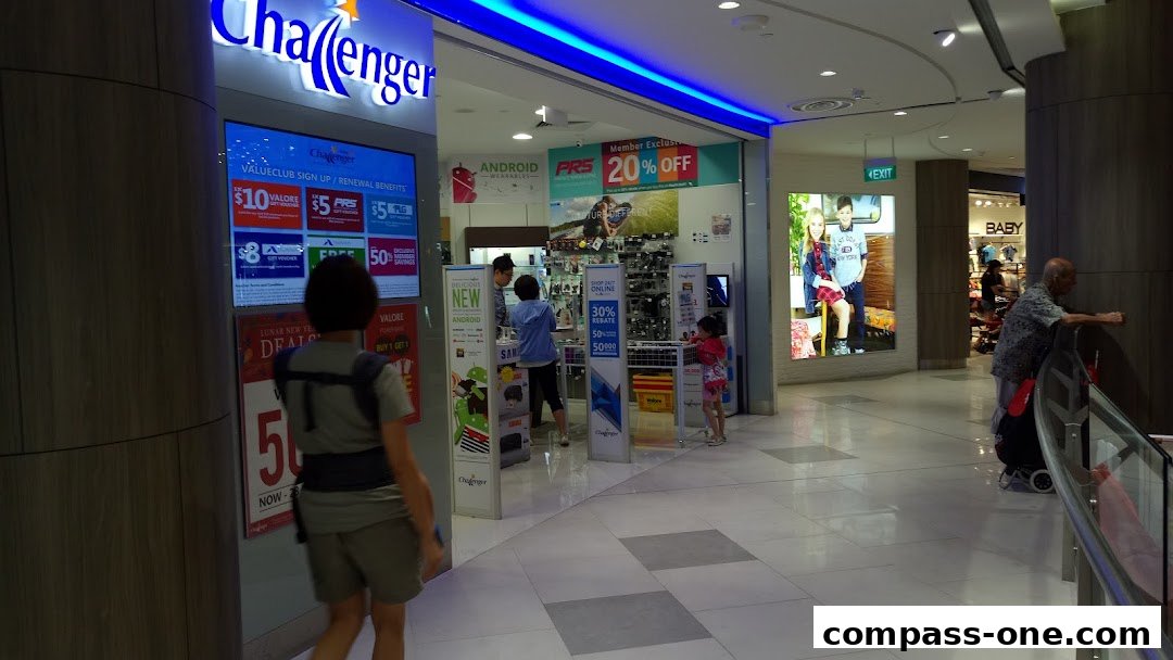 The Challenger electronics store entrance with promotional displays and shoppers.