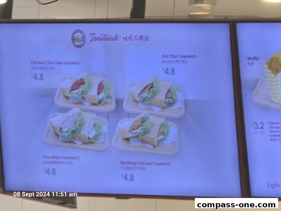 A digital menu board displaying various toastwich options and prices.