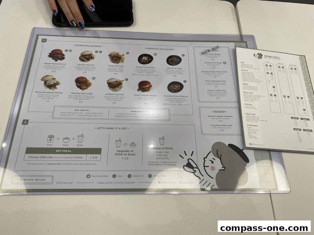 A menu from Zoeys featuring signature baobae, salads, desserts, and drinks.