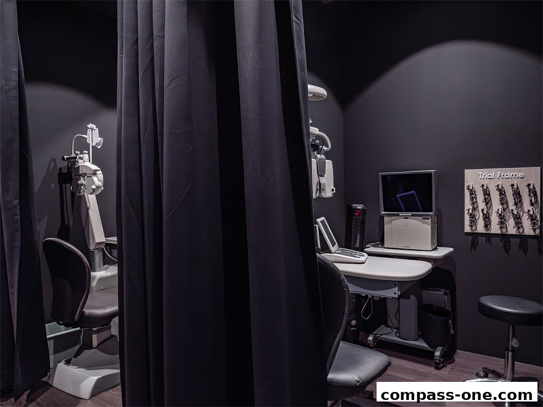 An eye examination room with optical equipment and trial frames.