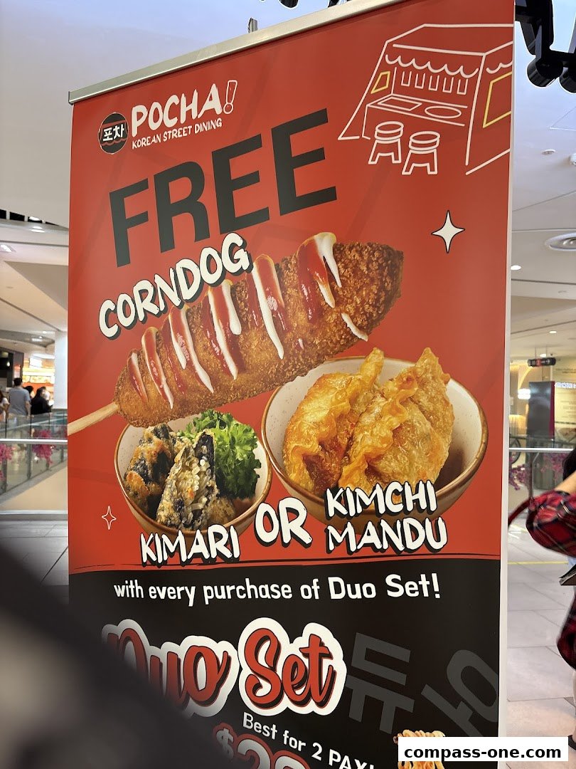A promotional banner for POCHA! Korean Street Dining offering a free corndog with a Duo Set purchase.