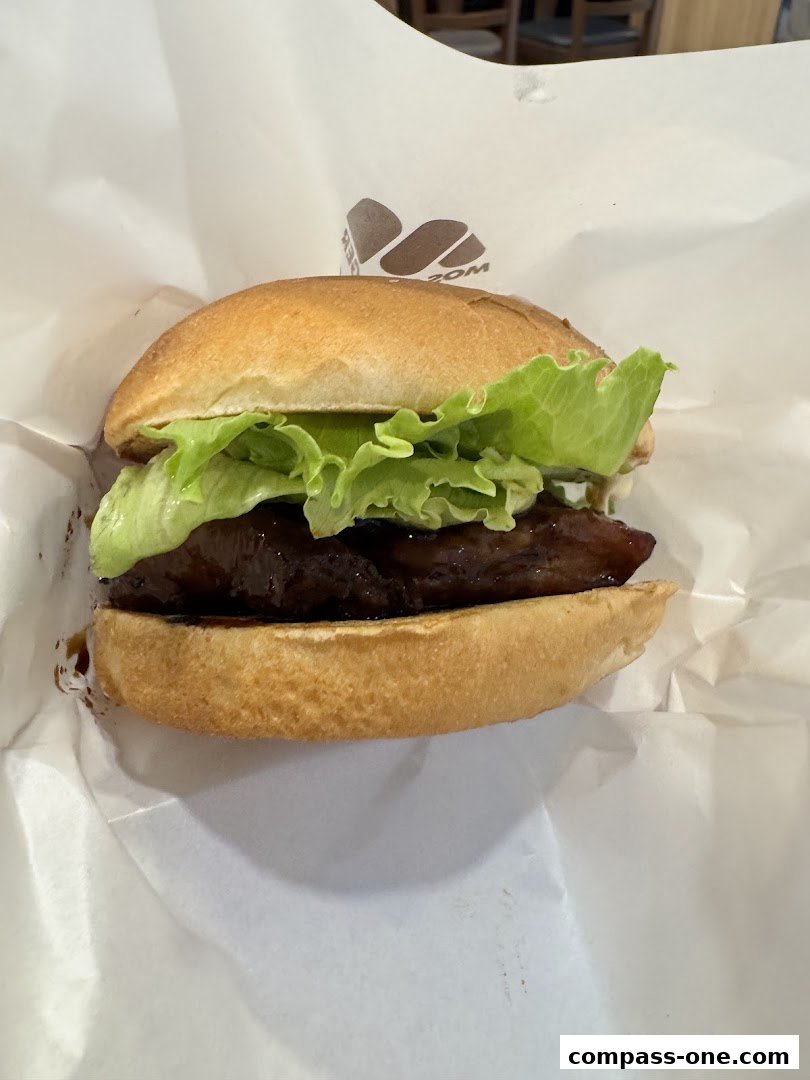 A close-up shot of a delicious MOS Burger with fresh lettuce and a savory patty.