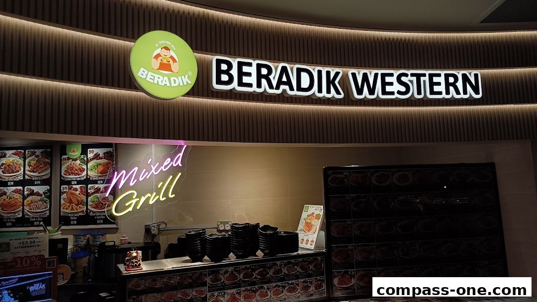 The storefront of Beradik by Western Boy, featuring a neon sign and a display of food.