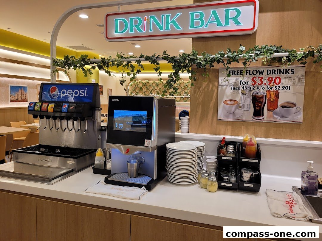 A drink bar with a Pepsi soda fountain and a Nescafé machine.