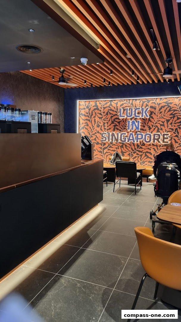 Interior of a Luckin Coffee shop with seating and a decorative wall.