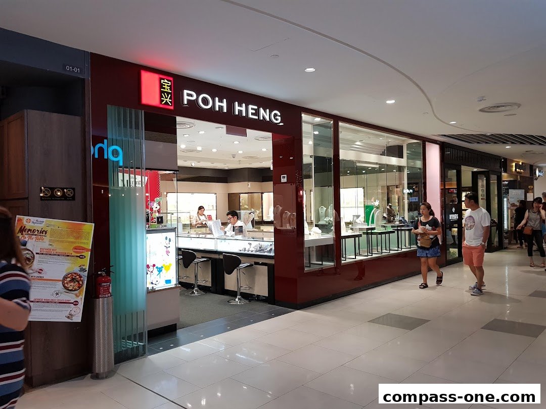 The Poh Heng Jewellery store front with displays of jewelry and customers inside.