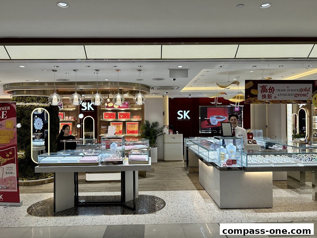 Interior view of SK Jewellery store with display cases and staff.