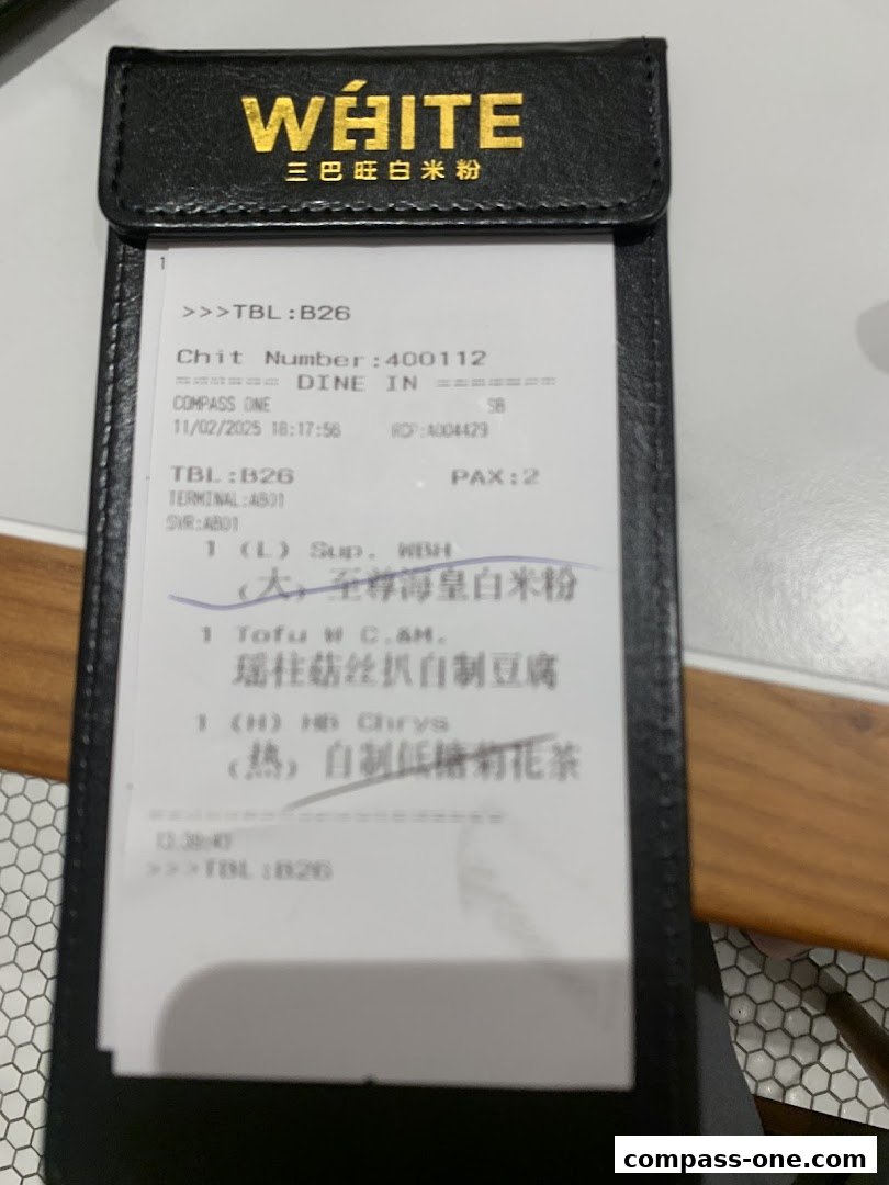 A receipt from White Restaurant showing ordered items and transaction details.