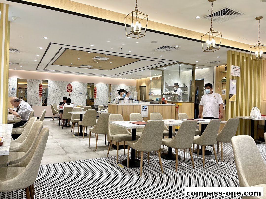 Interior view of Boon Tong Kee restaurant with diners and staff.