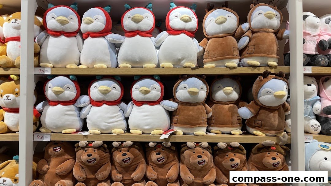 Shelves filled with adorable plush toys, featuring penguins and bears in various outfits.