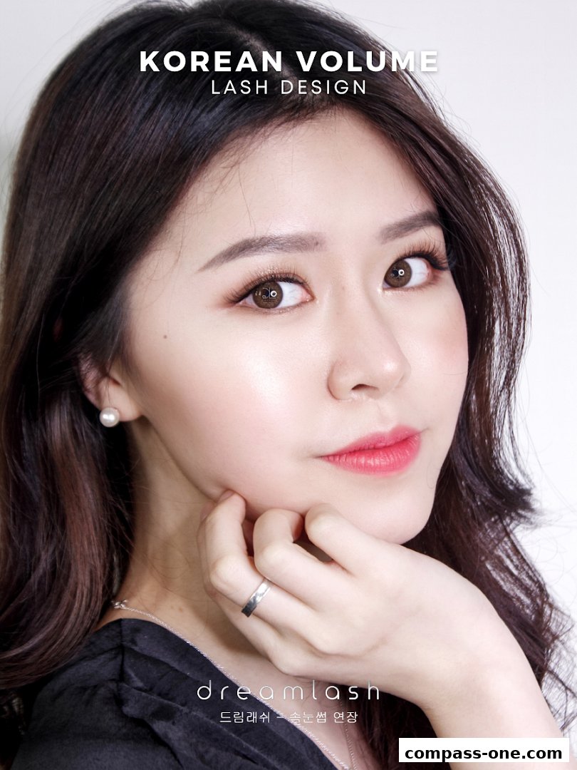 A close-up portrait of a woman showcasing Korean volume lash design.