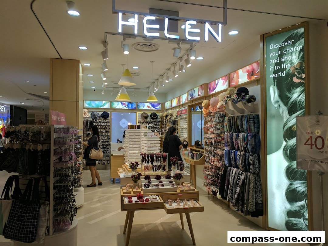 Interior view of a Helen accessories shop with various hair accessories and bags on display.