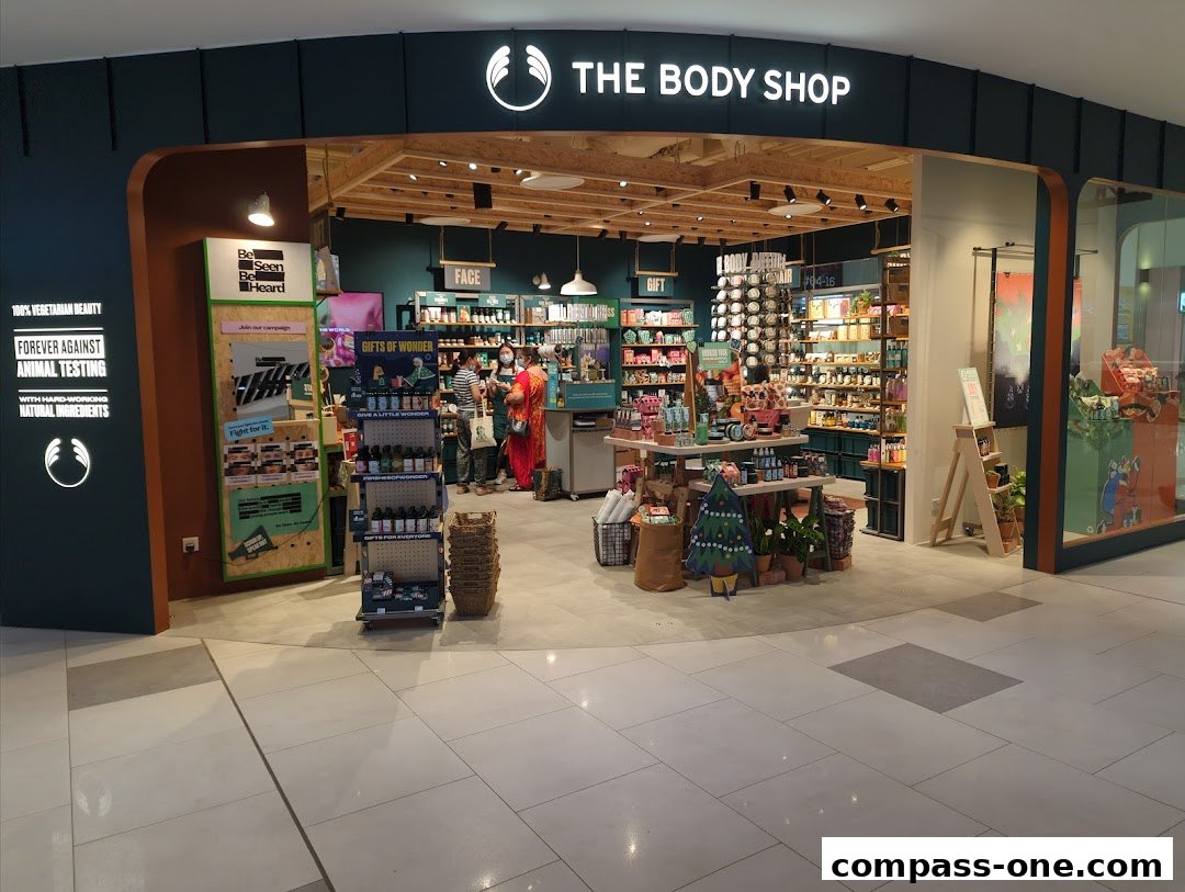 The Body Shop storefront displaying various beauty products and promotional materials.