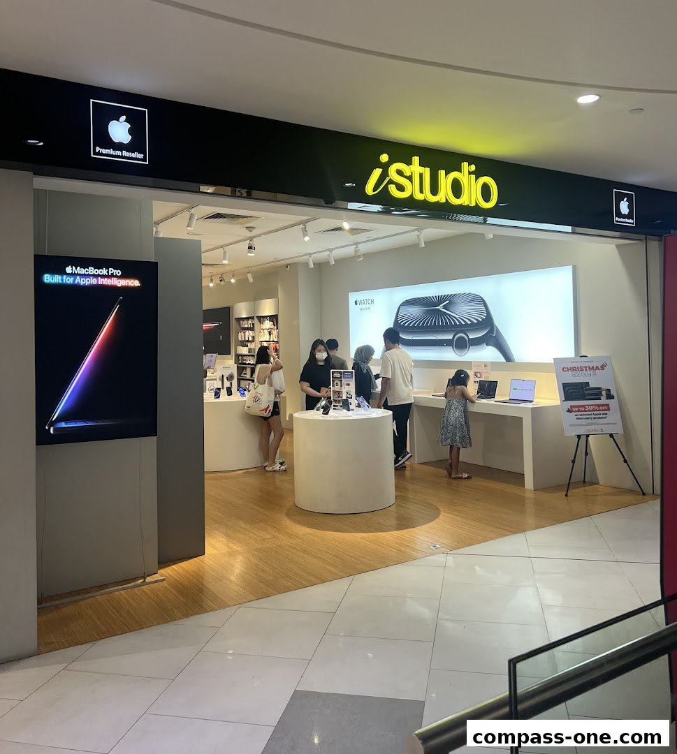 The iStudio Apple Premium Reseller shop front with customers browsing products.