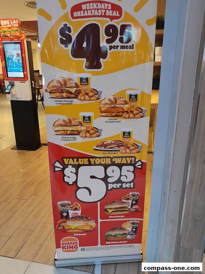 A Burger King promotional banner showcasing breakfast deals and value sets with food items.