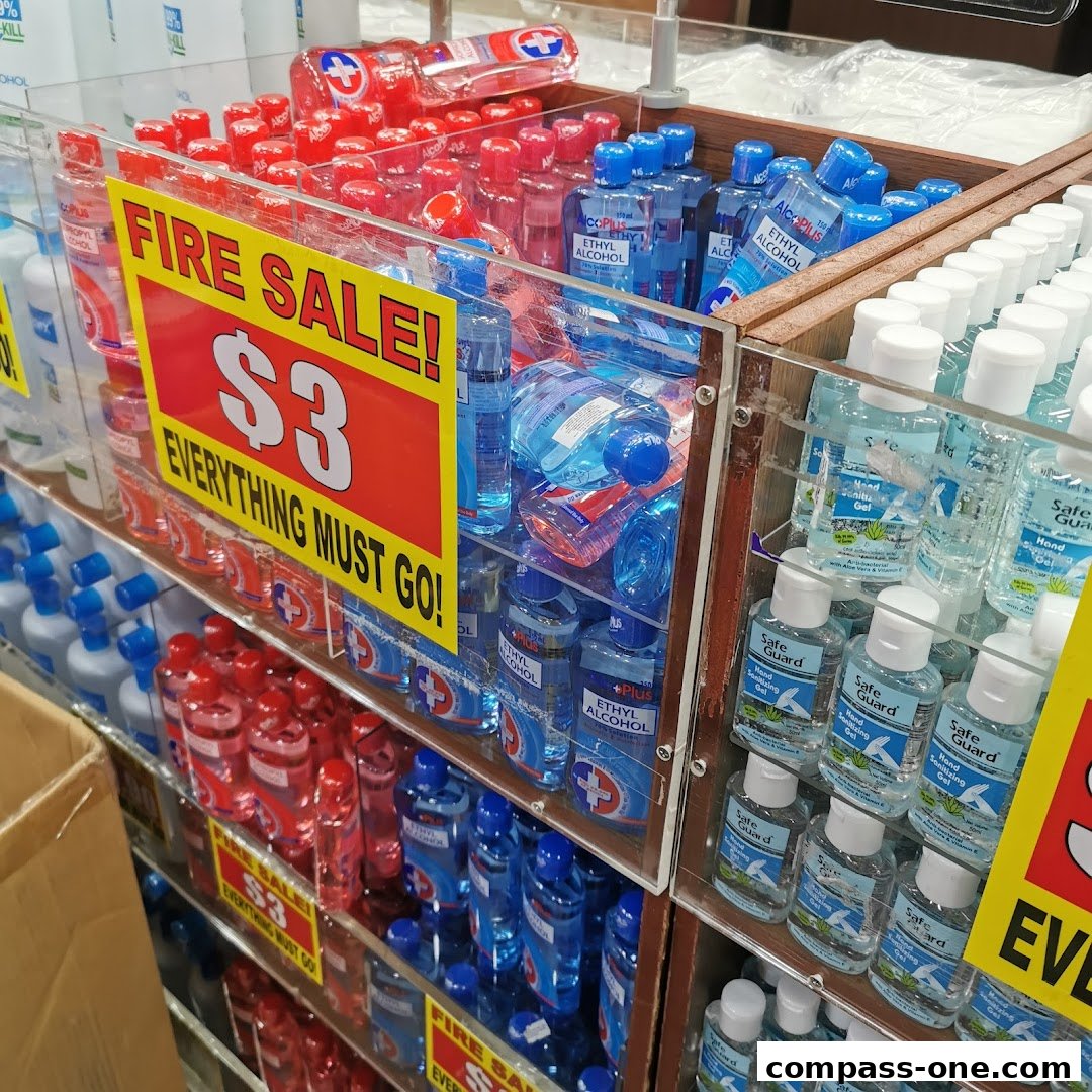 A display of hand sanitizers and ethyl alcohol bottles with a prominent 'Fire Sale!' sign.