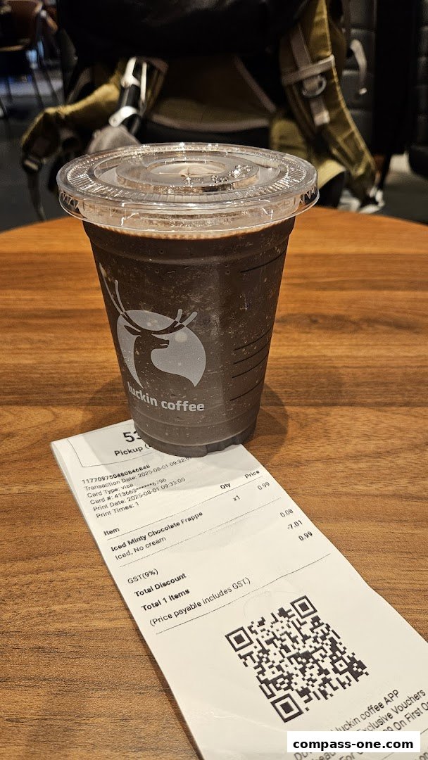 A cup of iced chocolate frappe from Luckin Coffee with a receipt.