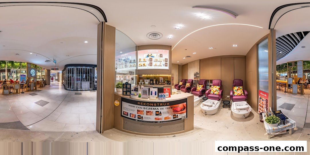 Interior view of a nail spa with pedicure chairs and a reception counter.