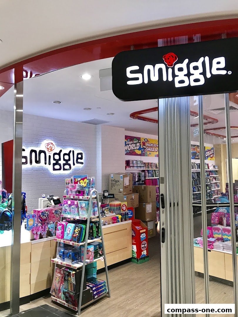The entrance of a brightly lit Smiggle store, showcasing colorful stationery and school supplies.