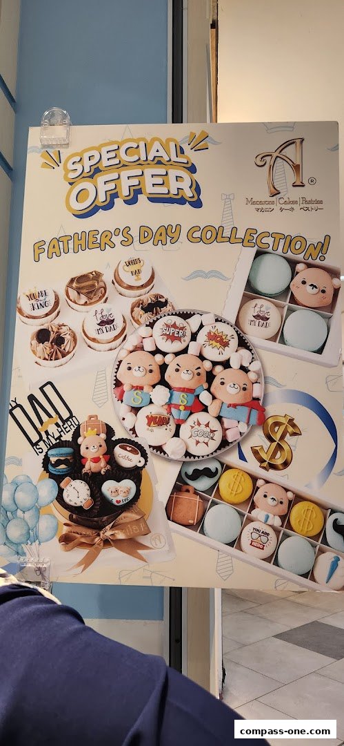 A promotional poster for Annabella Patisserie's Father's Day collection, featuring macarons and pastries.