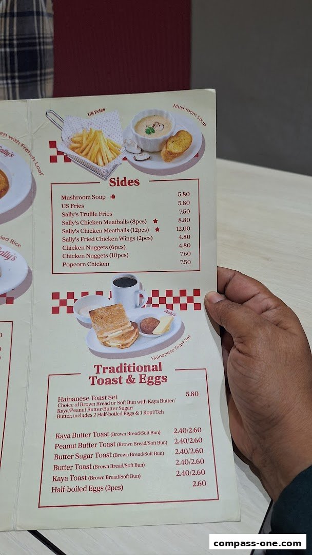 A menu from Sallys Compass One featuring sides and traditional toast and egg sets.