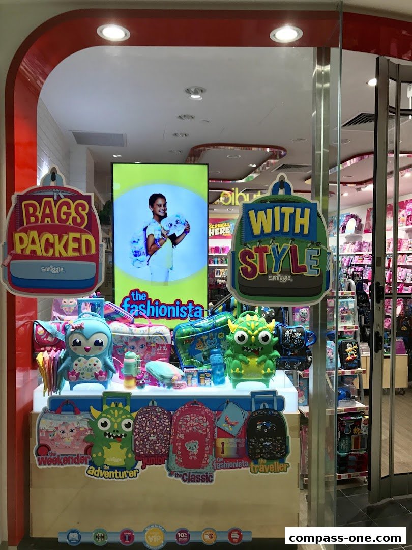 Smiggle shop window display featuring colorful backpacks and accessories for kids.