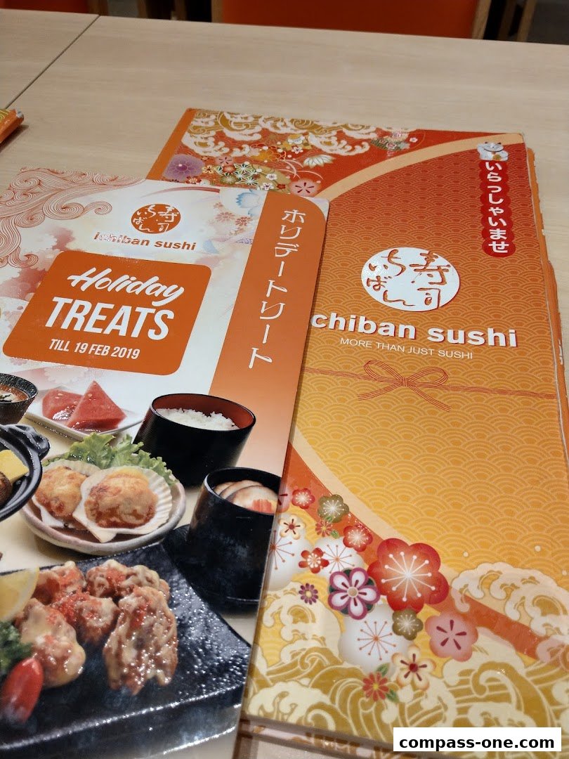 A close-up view of Ichiban Sushi menus, featuring food images and promotional text.