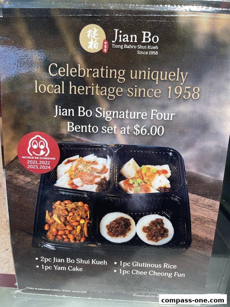 A bento box featuring Jian Bo Signature Four with Shui Kueh, Yam Cake, Glutinous Rice, and Chee Cheong Fun.