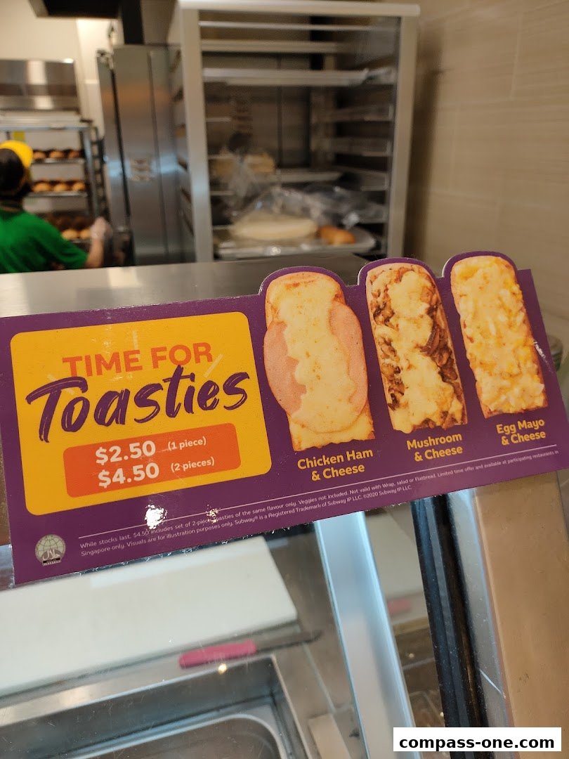 A sign advertising Subway's "Toasties" with prices and flavor options.