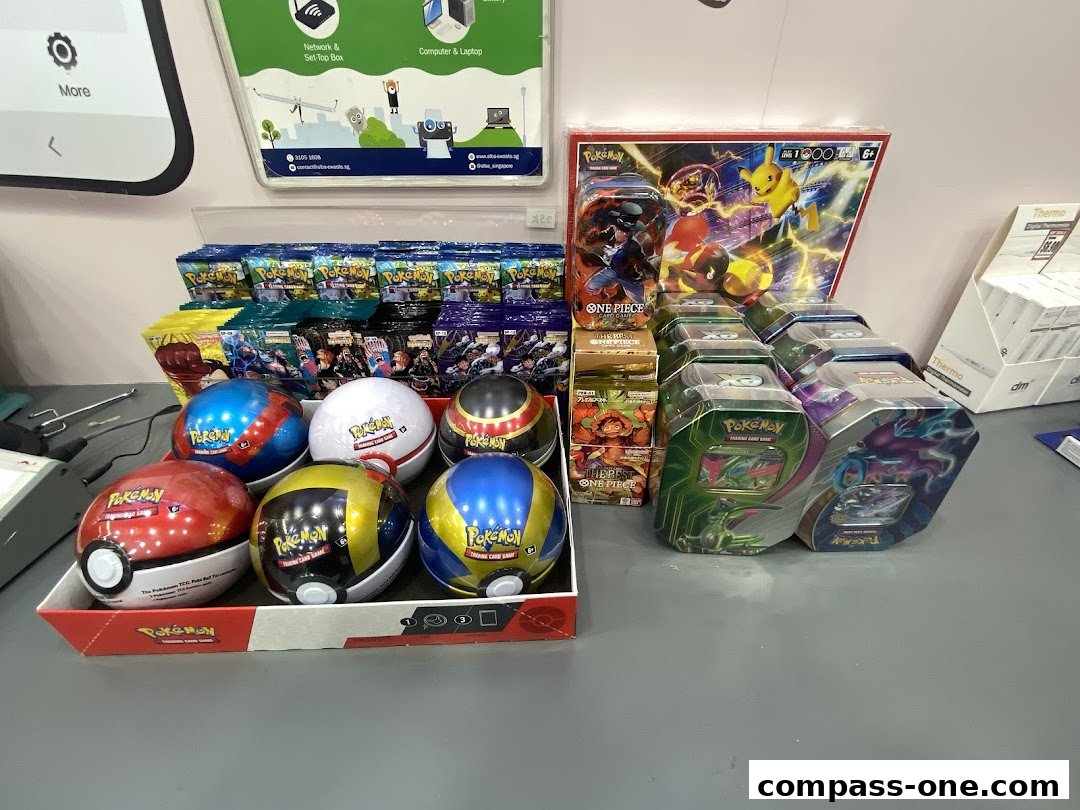 A display of Pokemon and One Piece trading card game products, including booster packs and tins.