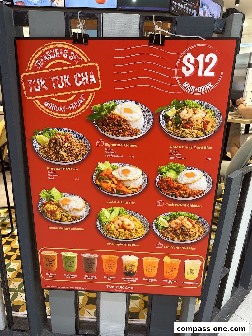 A menu board for Tuk Tuk Cha Treasures featuring various Thai dishes and drinks.