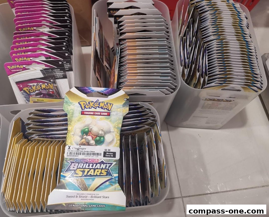 A display of various Pokémon trading card game booster packs in containers.