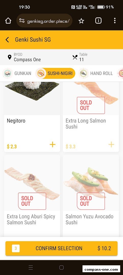 A screenshot of the Genki Sushi SG ordering app showing sushi items and prices.