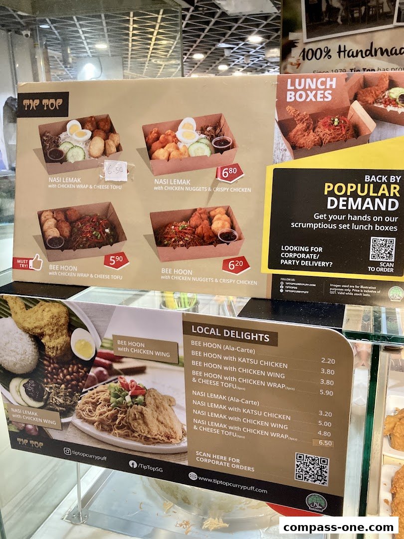 A menu display for Tip Top Curry Puff featuring various nasi lemak and bee hoon dishes.