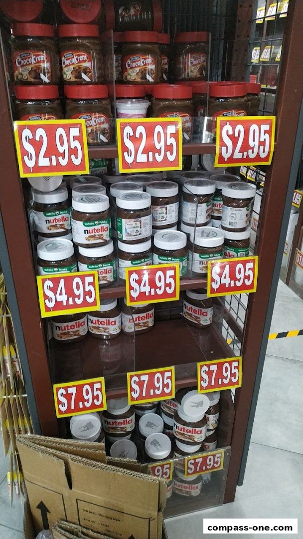 Jars of Nutella and ChocoKrem are displayed on shelves with price tags.