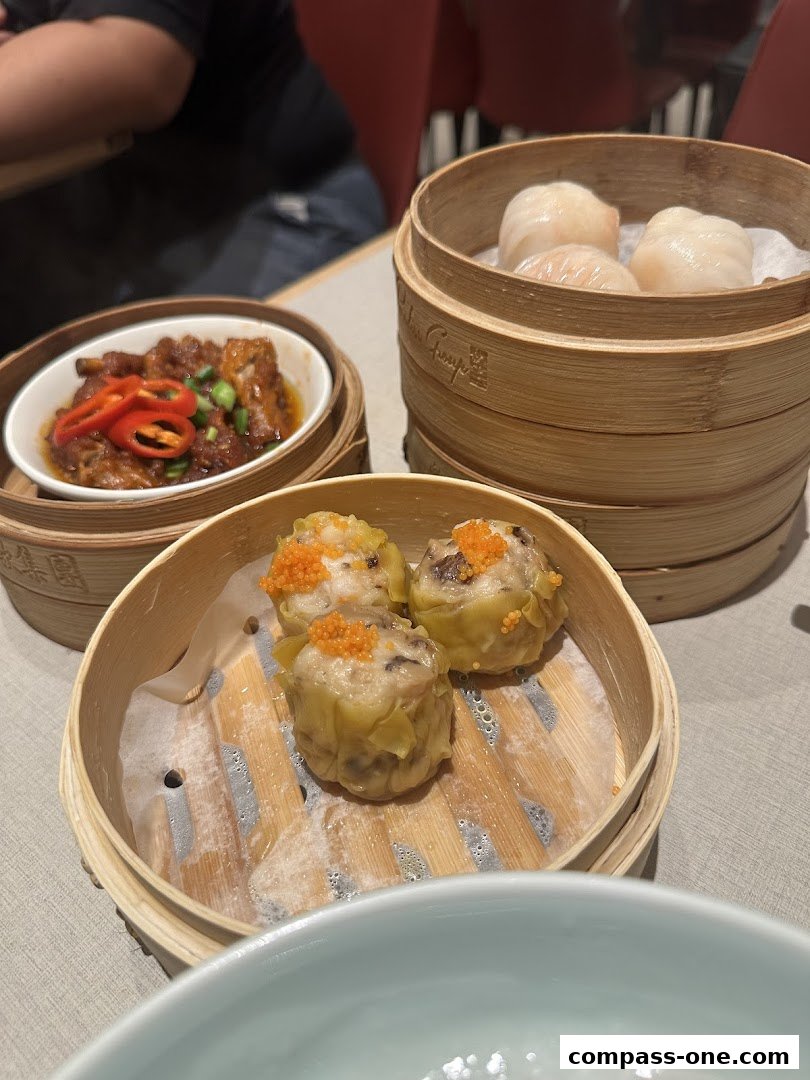 A close-up of delicious dim sum dishes, including steamed dumplings and chicken feet.
