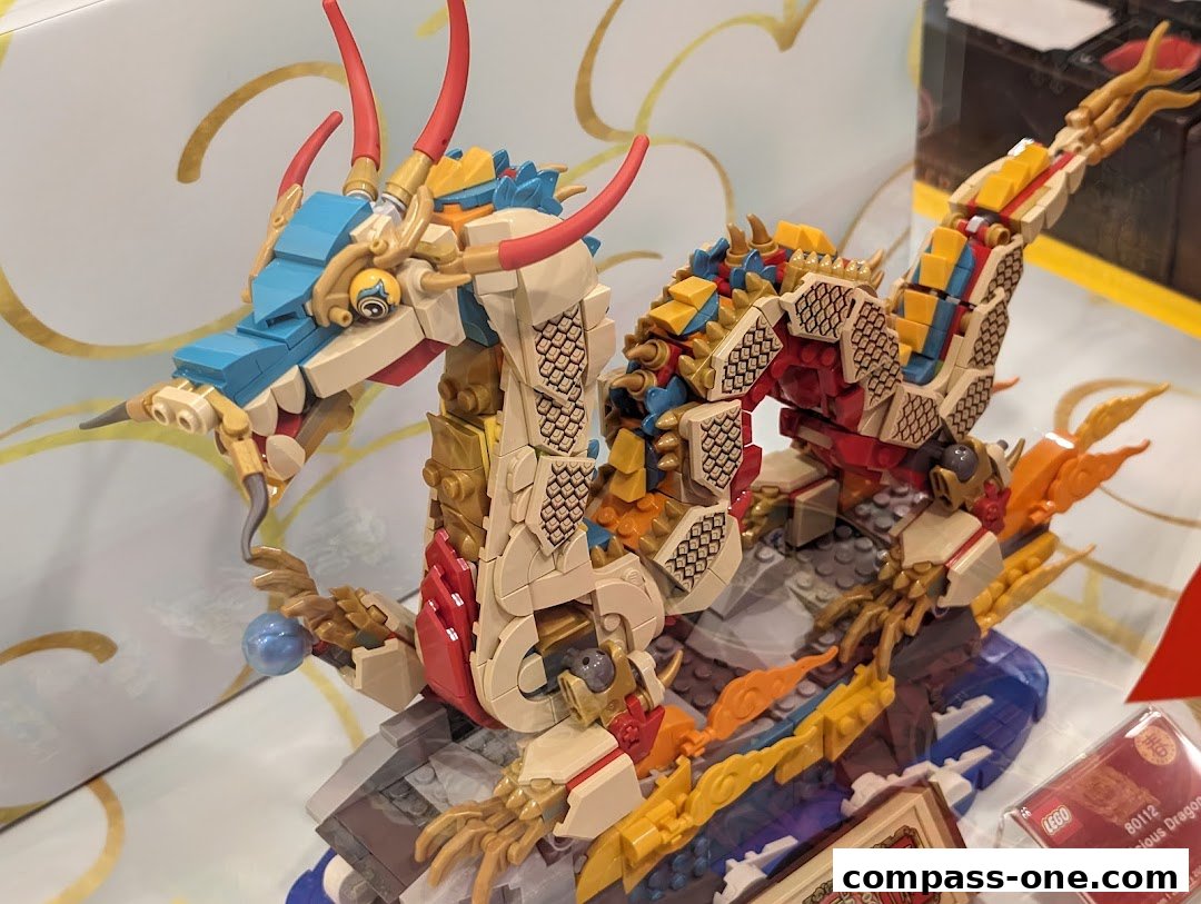 A detailed LEGO model of an auspicious dragon with intricate brickwork and vibrant colors.