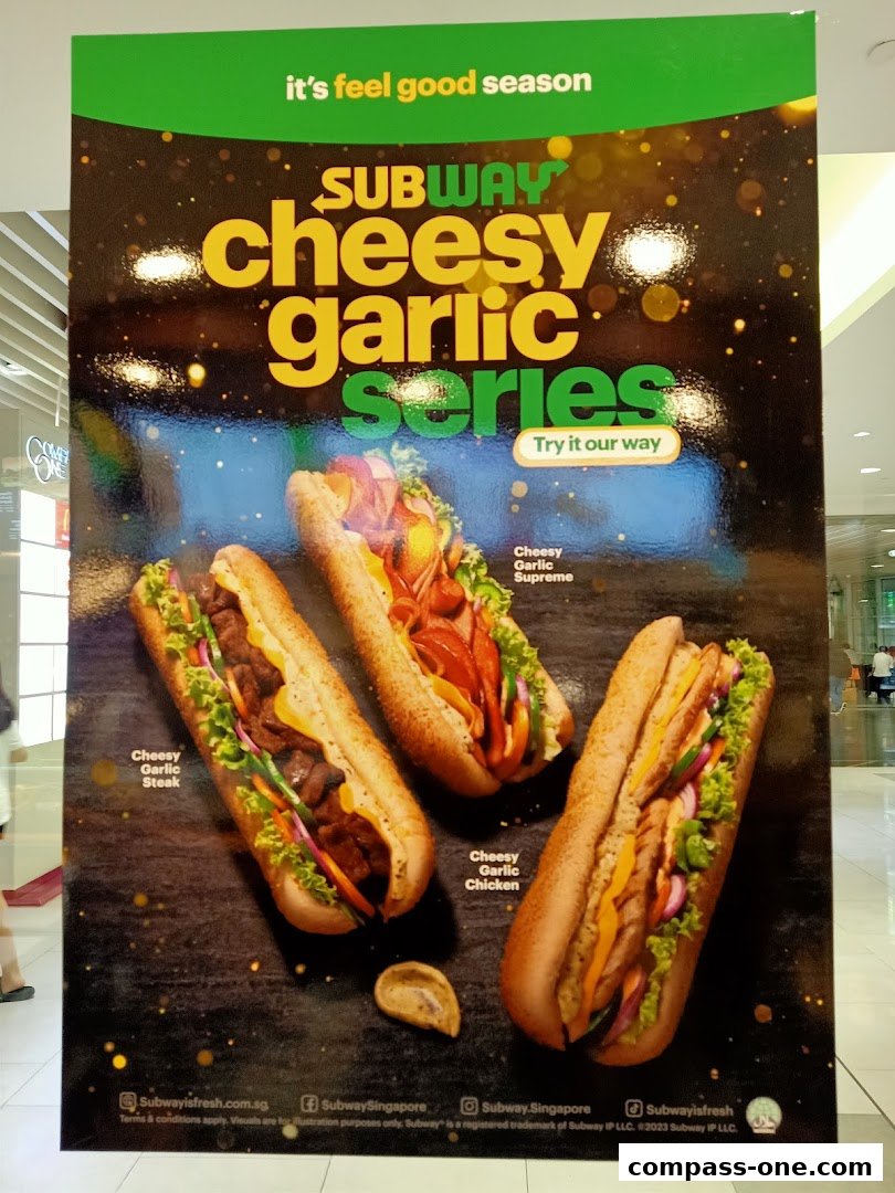 A promotional poster for Subway's Cheesy Garlic Series featuring three different subs.