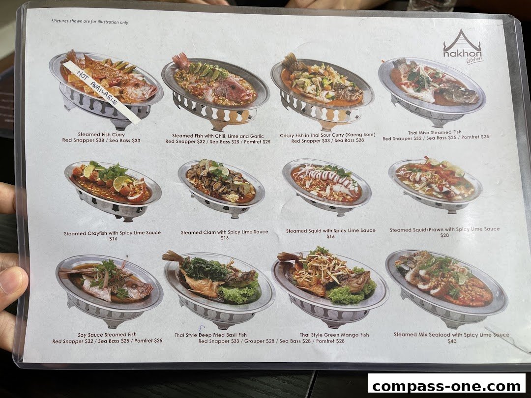 A menu from Nakhon Kitchen featuring various Thai seafood dishes with prices.