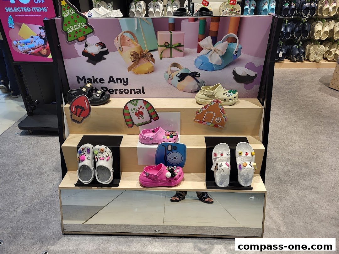 Crocs store display featuring personalized shoes and holiday-themed decorations.