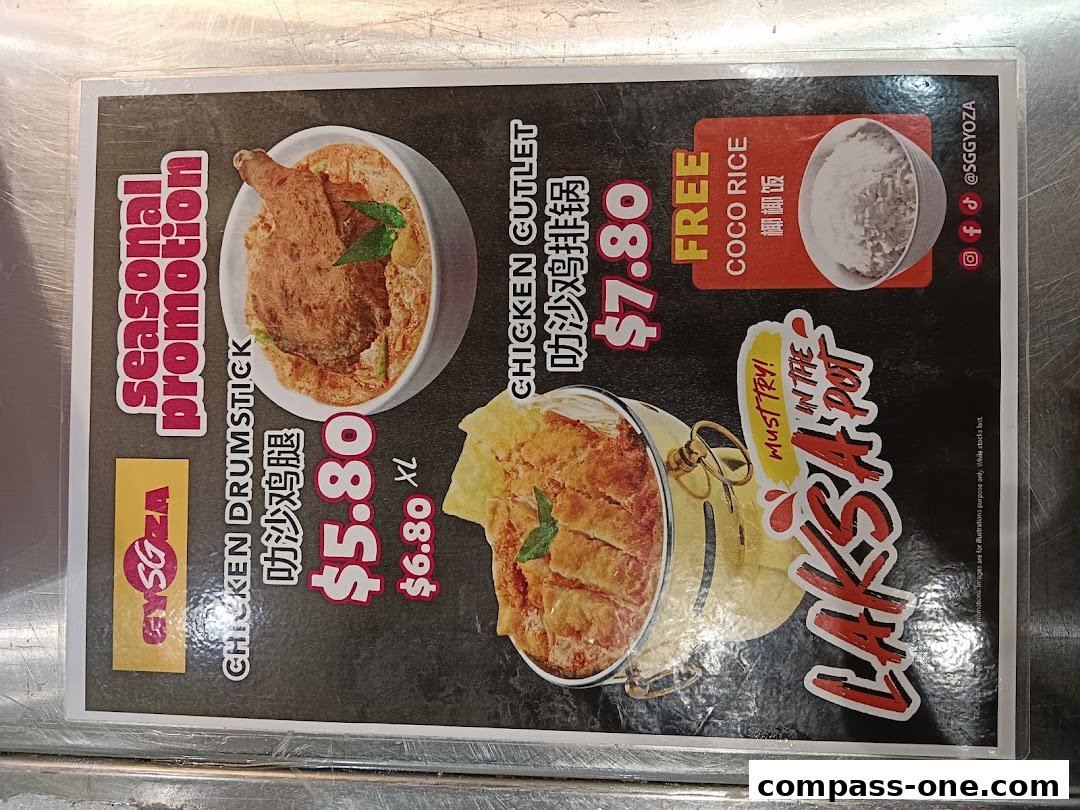 A menu board showcasing seasonal promotions for Chicken Drumstick and Chicken Cutlet Laksa.
