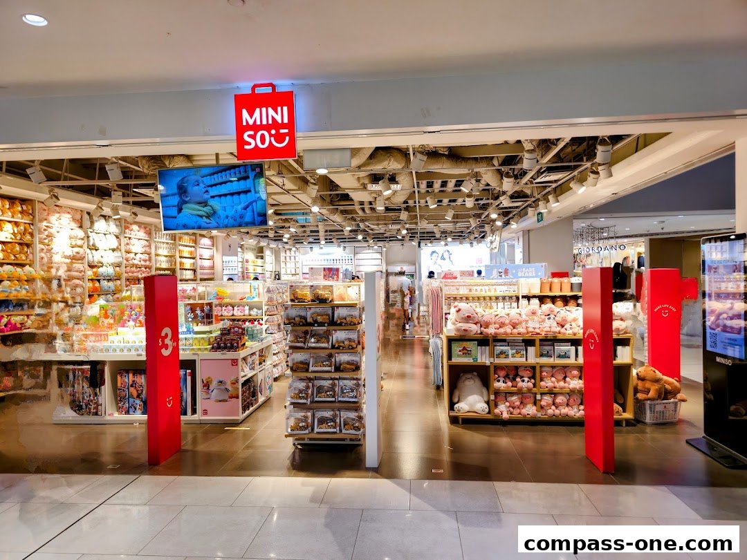 The entrance of a MINISO store filled with plush toys, stationery, and other merchandise.