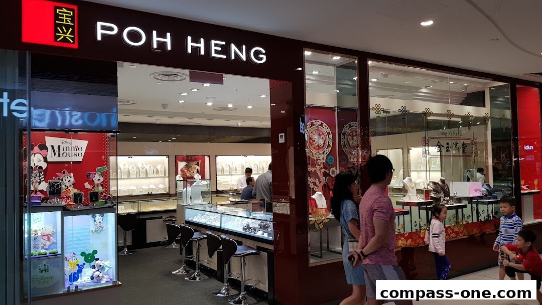 Poh Heng Jewellery store entrance with displays of jewelry and Disney merchandise.