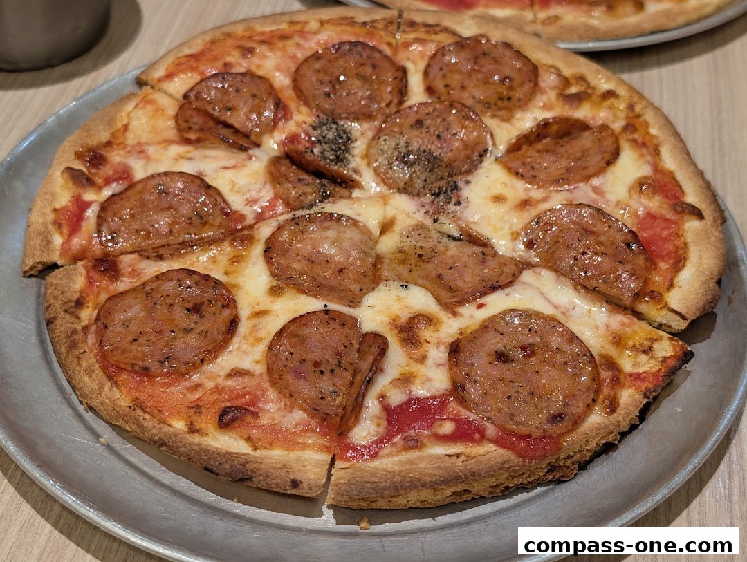 A close-up shot of a delicious pepperoni pizza served on a metal plate.
