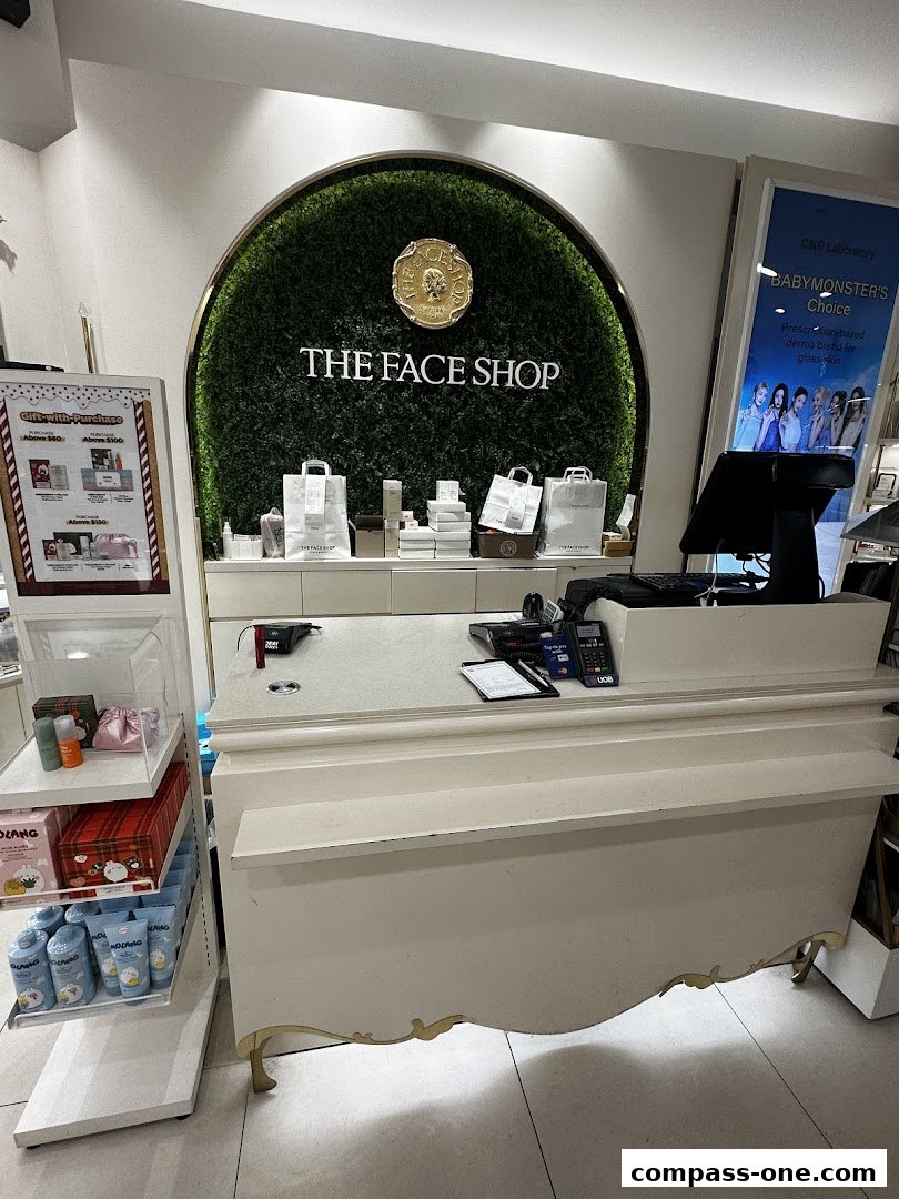 Interior view of The Face Shop counter with products and promotional displays.